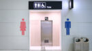 Public toilet entrance in modern airport building plasangst