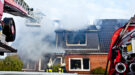 Firefighters turntable ladder at house fire Brand in huis